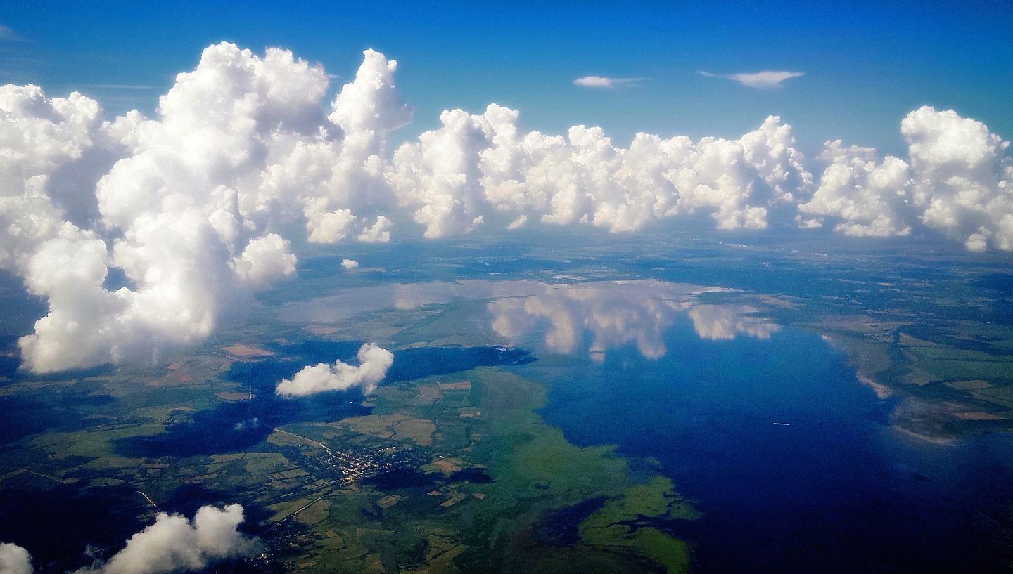 Earth's horizon with clouds in the sky